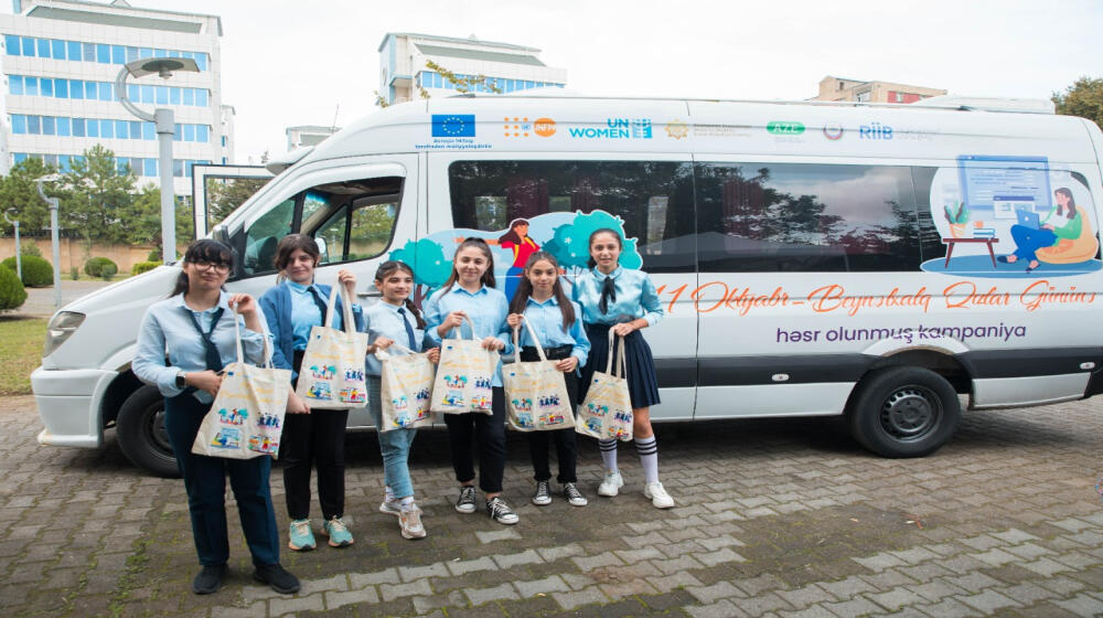 People standing outside a van